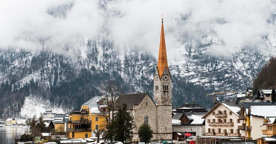 From Vienna: Traunkirchen, Hallstatt & Salzburg Day Trip - Traunkirchen on Lake Traunsee: photos, calm water, and a winter caveat